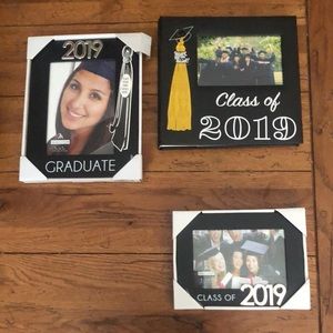 2 2019 graduation picture frames and 1 2019 photo album.
